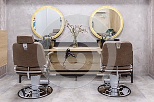 Empty modern interior of hair salon in golden and grey color