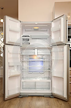 Empty modern refrigerator with open doors