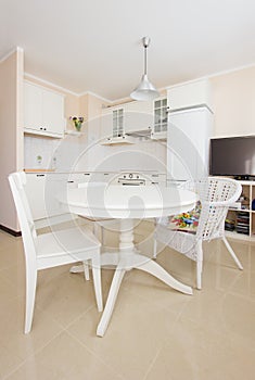 Rustique white kitchen with dinning table photo