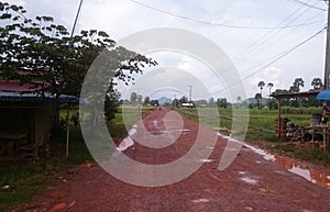 Empty muddy road on the countryside of cambodia