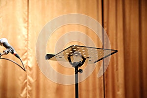 Empty music stand on the stage as a background