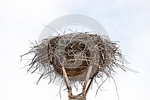 Empty nest of storks on lamppost