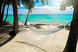 Empty net hammock at tropical beach resort