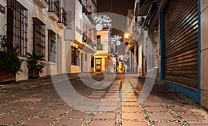 Empty night street of Marbella town, Andalusia, Spain