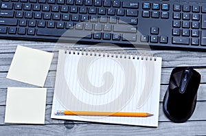 Empty notebook with keyboard pc mouse and notes