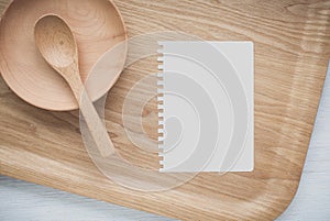 Empty notebook and kitchen utensils