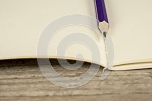 Empty notebook and pencil