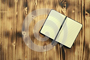 Empty notebook on wooden planks