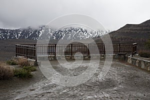 Empty observation deck in the mountains. Stormy weather, low clo