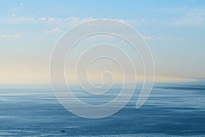 An empty ocean with a blue sky and copy space. A wide open seascape background of a beach with calm water. Scenic sea
