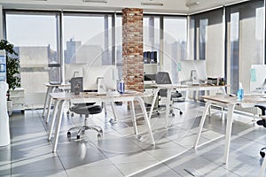 Empty open plan office with multiple work stations