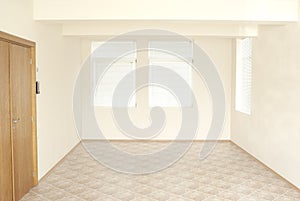 Empty office room with wooden door