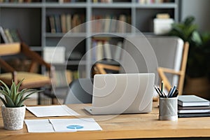 Empty office workplace with work desk notebook paper documents stationery