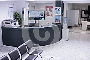 Empty offices with unoccupied desks, chairs in lonely medical clinic