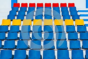 Empty old blue seats in the blue,yellow and red