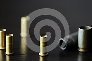 Empty old bullet cartridges on a dark background