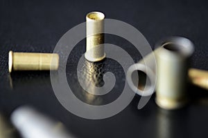 Empty old bullet cartridges on a dark background