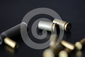 Empty old bullet cartridges on a dark background