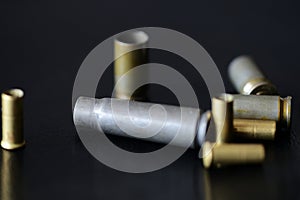 Empty old bullet cartridges on a dark background