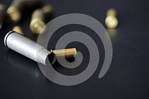 Empty old bullet cartridges on a dark background