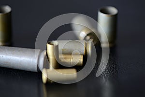 Empty old bullet cartridges on a dark background