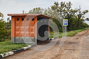 Empty old bus stop on the road