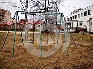 Empty old children`s swings