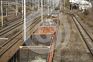 Empty old freight train wagons and in a station