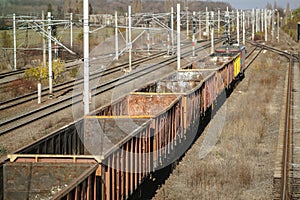 Empty old freight train wagons and in a station