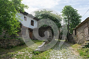 Empty old medieval path on antique residential village in past eastern europe town. Bulgarian small village alley