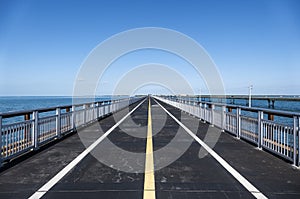 Empty Old Seven Mile Bridge Framed by the Blue Ocean and Sky photo
