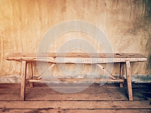 Empty old wood chair and cement wall vintage