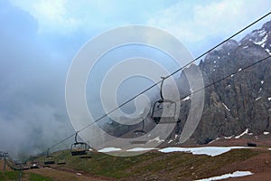 empty open cabins on a cable car in the mountains.