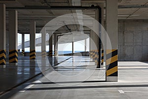 Empty open car parking garage on sunny day