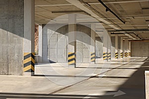 Empty open car parking garage on sunny day