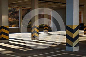 Empty open car parking garage on sunny day