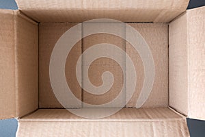 Empty open cardboard box, inside view. Close up