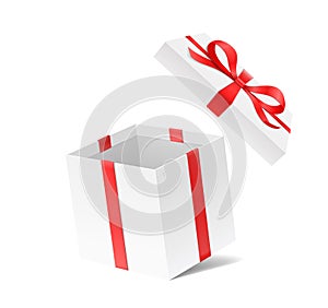 Empty open gift box with red color bow knot and ribbon isolated on white background.