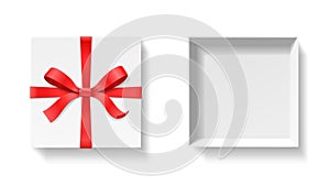 Empty open gift box with red color bow knot and ribbon isolated on white background.