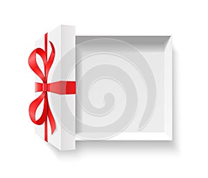 Empty open gift box with red color bow knot and ribbon isolated on white background.