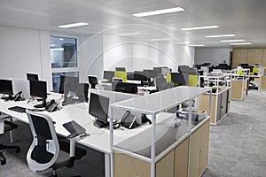 Empty open plan office with multiple work stations photo