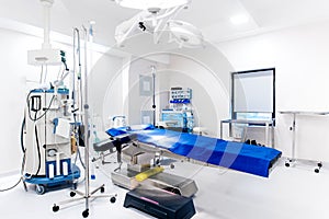 Empty operating room, life care support, operating table, lamps and medical equipment