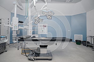 Empty operation room with surgery bed and surgery light
