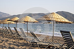 Empty otantic beach umbrellas empty beach in summer day
