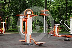 Empty outdoor gym with air walker, ovate stepper, twister and surfer