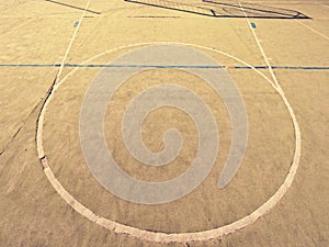 Empty outdoor handball playground, plastic hairy green surface on ground and white blue bounds lines.