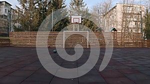 Empty outdoor mini football and basketball court