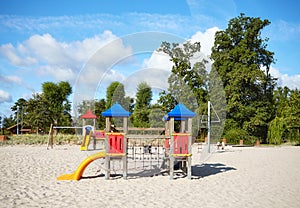 Empty outdoor playground on a beach on a sunny day