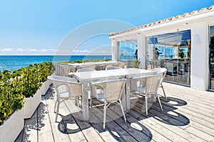 Empty outdoor restaurant near the sea. Spain