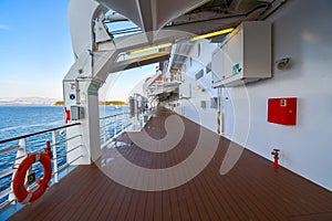 The empty outer deck of a cruise ship with no identifiable features cruising the Aegean Sea on a summer day photo